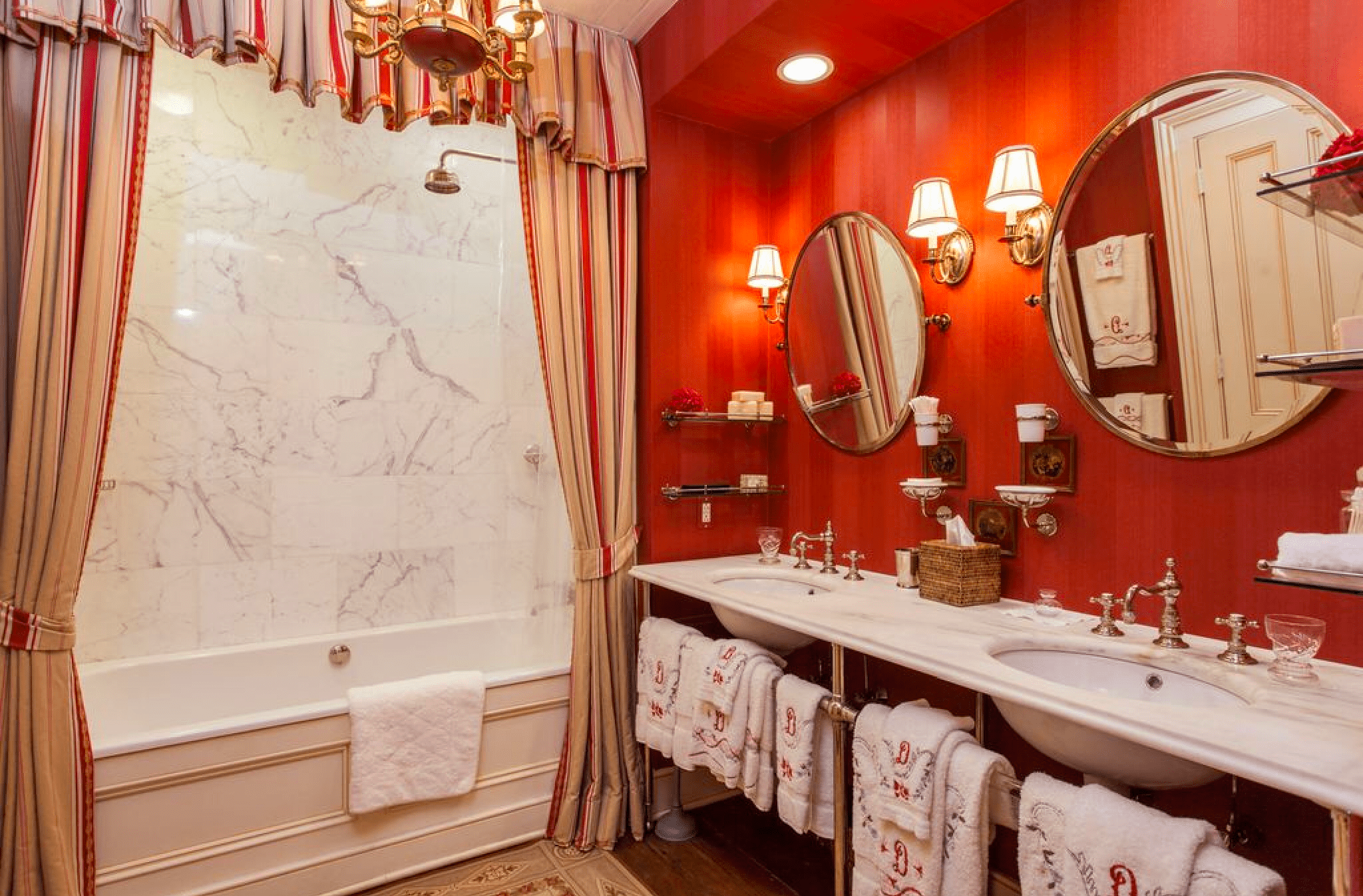 Pink wallpaper in bathroom with marble in historic home