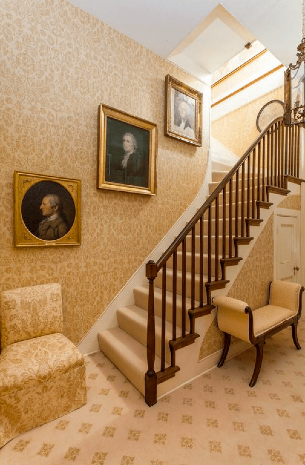 Back staircase with ancestor wall