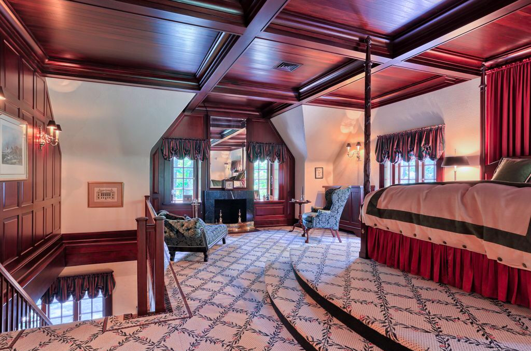 Cherry coffered ceiling, paneling, and fireplace surround in master suite