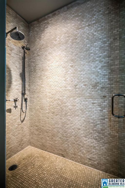 Walk in shower with stone walls
